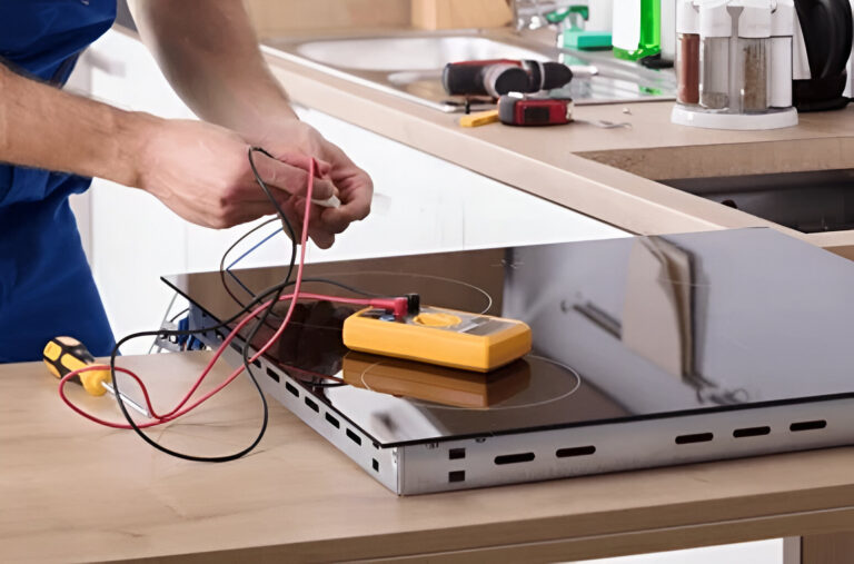 Electrician installing an oven and cooktop with compliant wiring in an Inner West kitchen