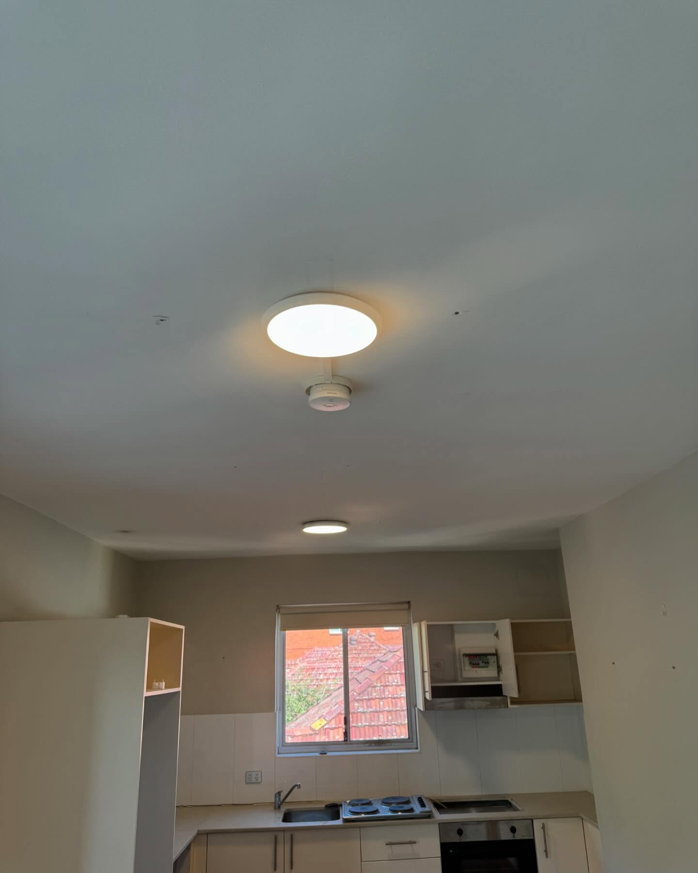 Professional pendant light installation in an Inner West kitchen